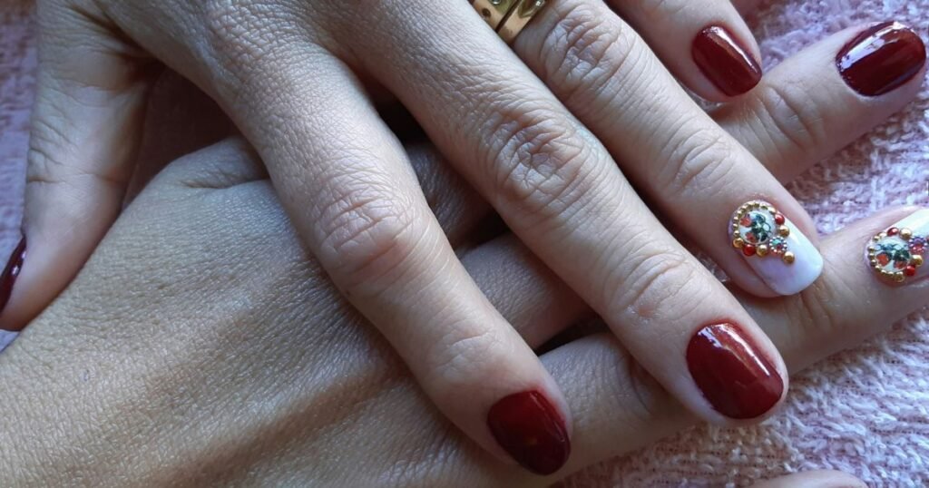 Deep Burgundy Nails With Jewel Accent