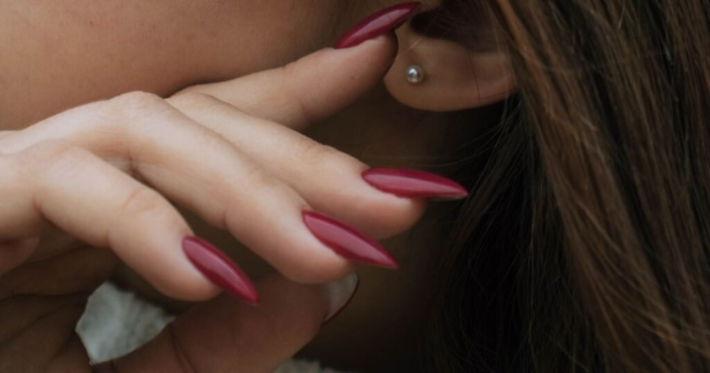 Glossy Maroon Almond Nails