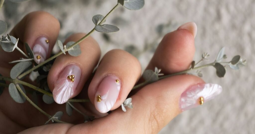 Iridescent Pearl Swirl Nails With Gold Dots