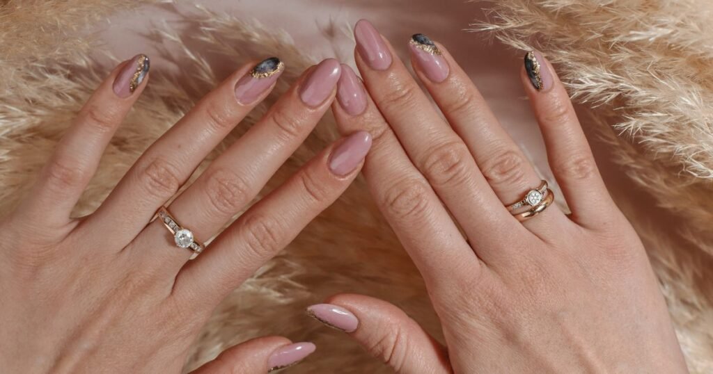 Nude French Tips With Black And Gold Glitter